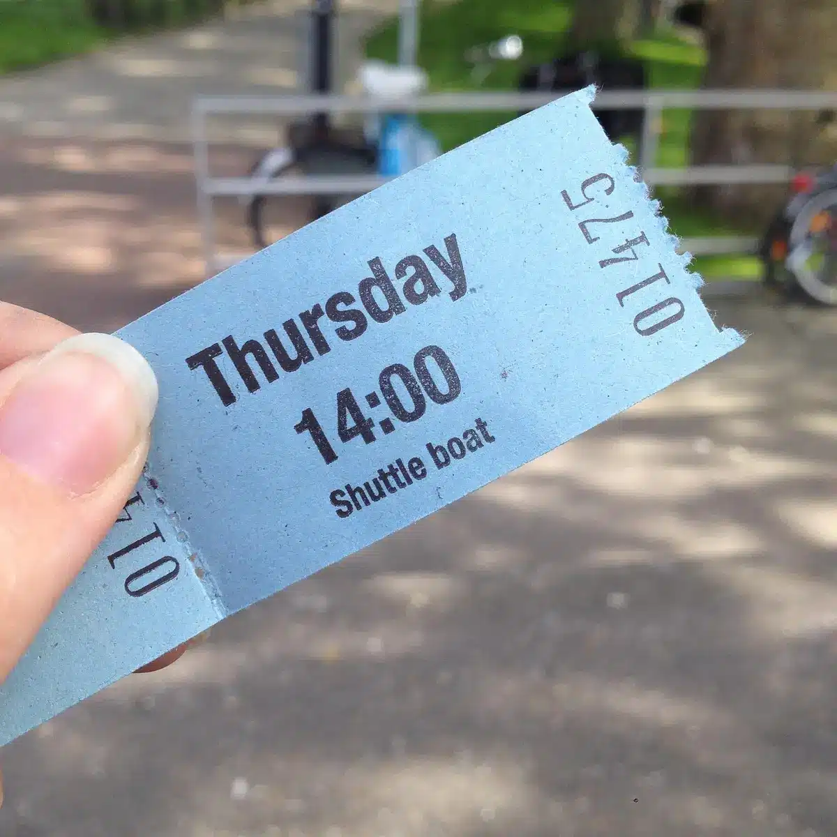 Close-up of a stack of generic paper match tickets on a wooden counter, no logos or text visible