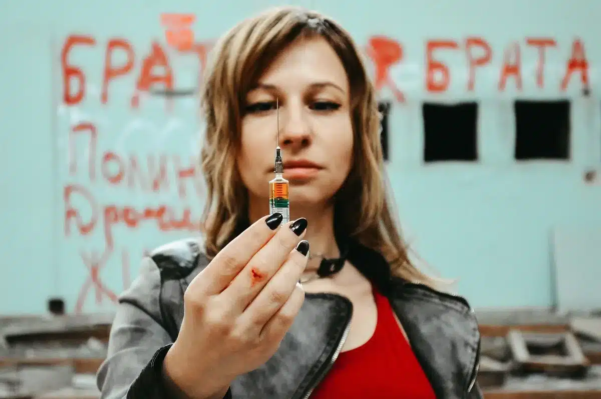anonymous hands passing a small packet across a table, dim interior, cash visible but unbranded